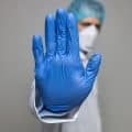 Doctor wearing respiratory mask for protection against viruses