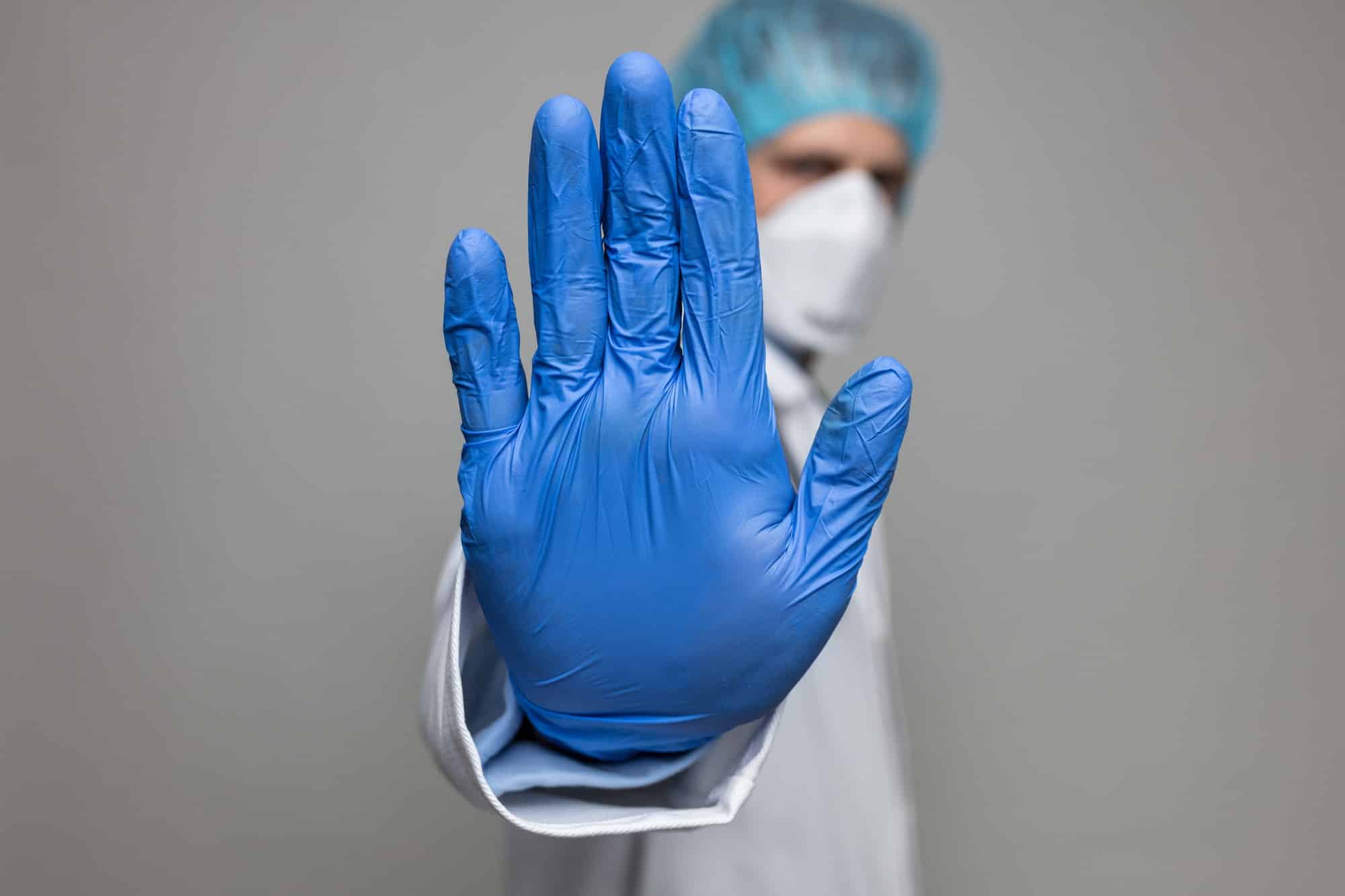Doctor wearing respiratory mask for protection against viruses