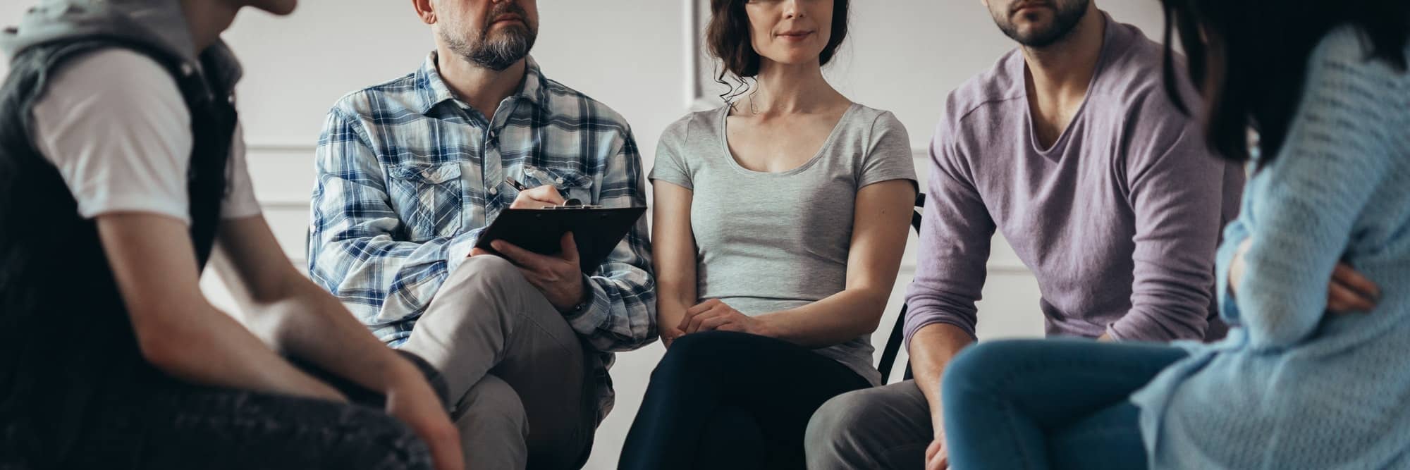 Group meeting with counselor for people trying to gain life balance