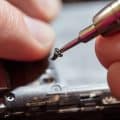 Man Repairing A Mobile phone