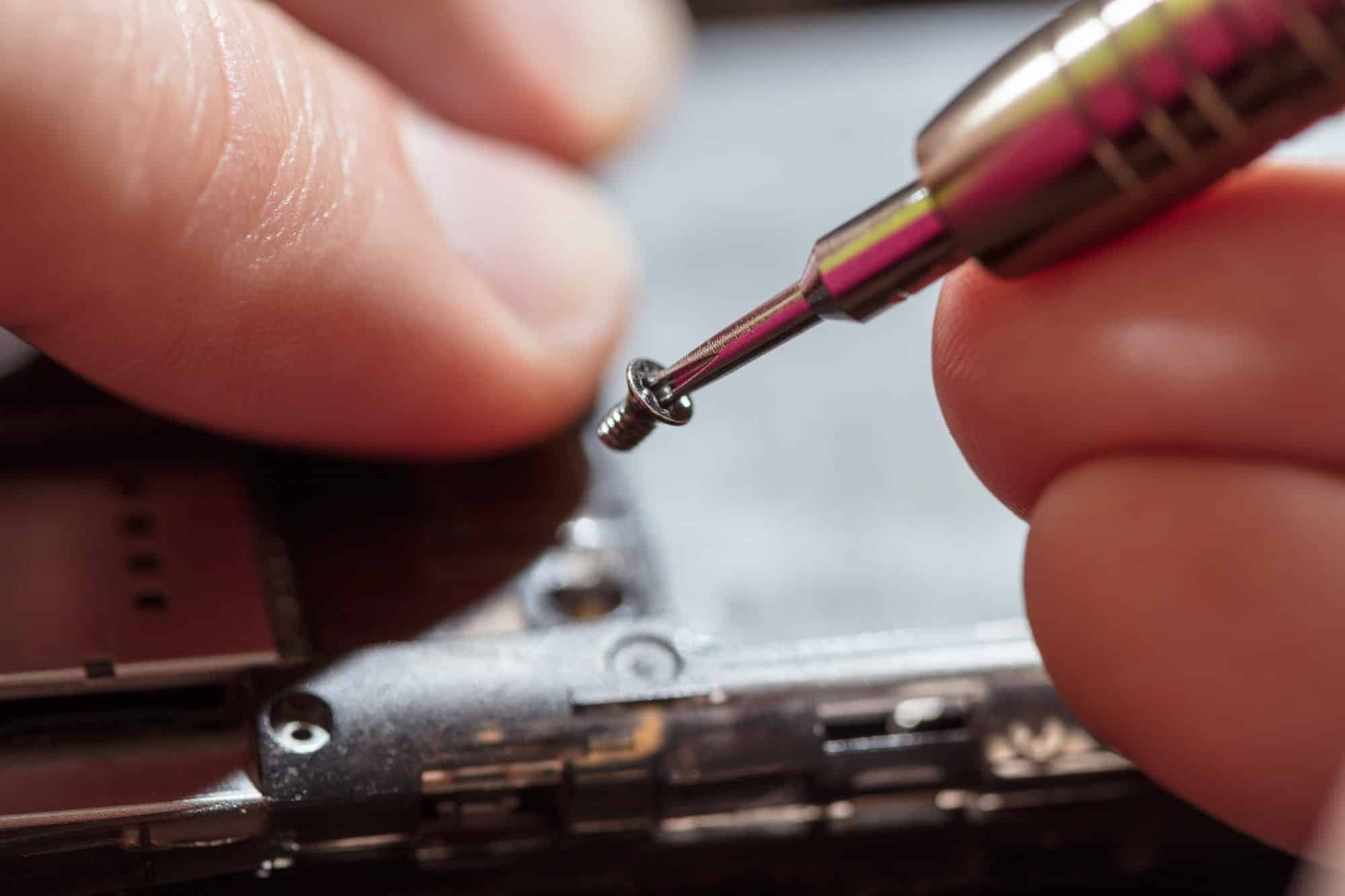 Man Repairing A Mobile phone