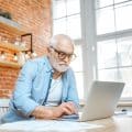 Senior man with laptop