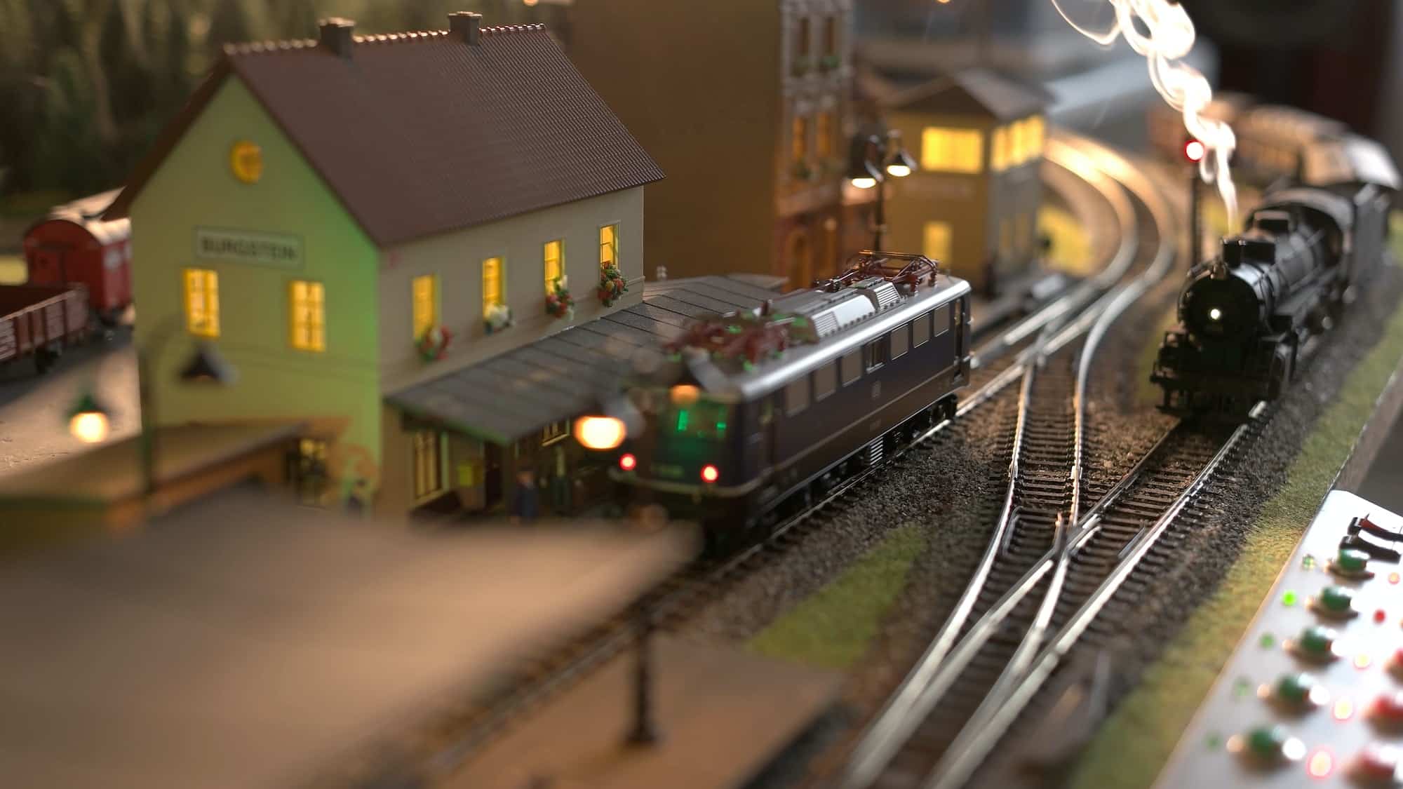Scale model railway layout with steam locomotives.