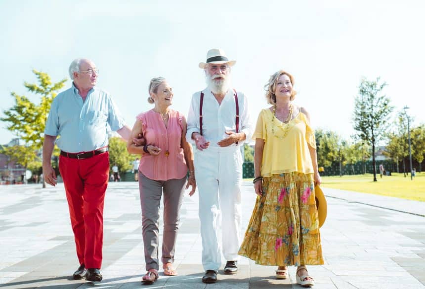 Group of seniors walking and having fun in the city