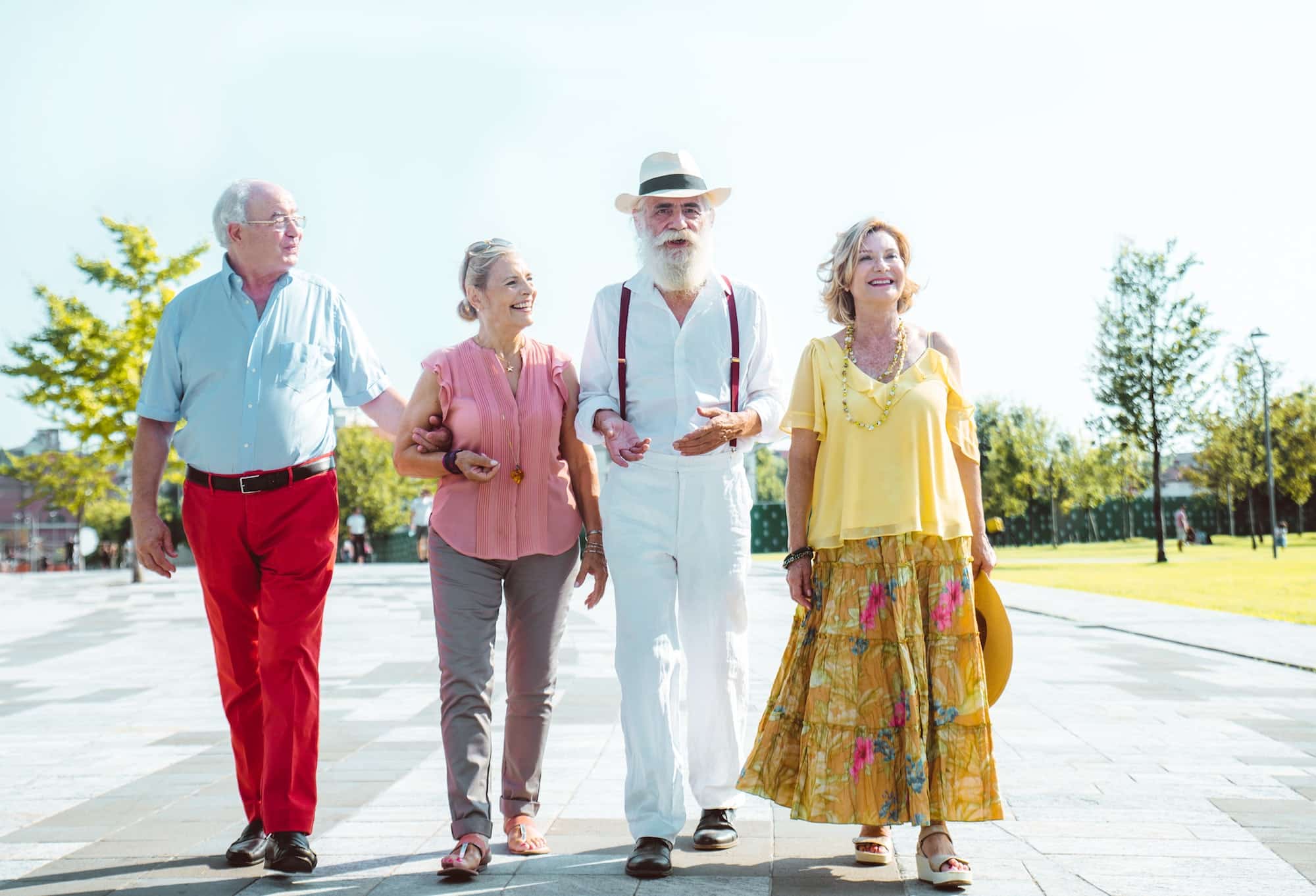 Group of seniors walking and having fun in the city