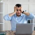 Desperate Arab businessman having too much work, making mistake, cannot meet deadline, suffering
