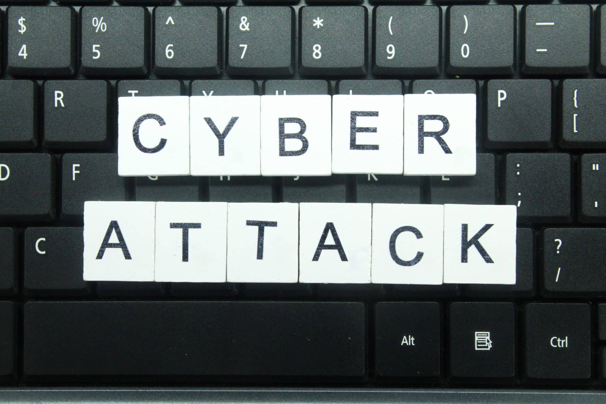white square with cyber attack alphabet letters. cyber attack concept