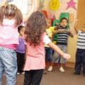 Dancing to get rid of all the energy. Preschool students jumping and dancing around having fun.