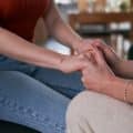 Detail of human hand's held by another person