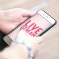 Live stream - woman holding a mobile phone