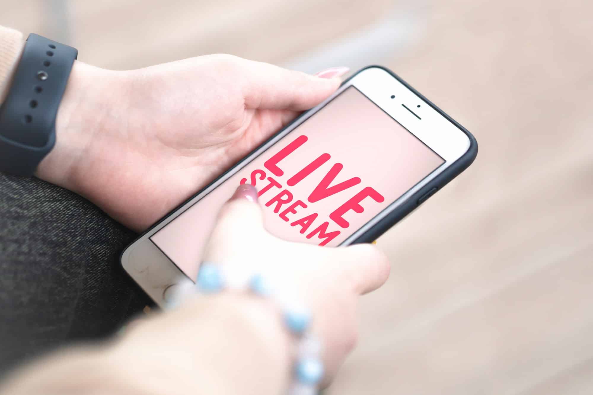 Live stream - woman holding a mobile phone